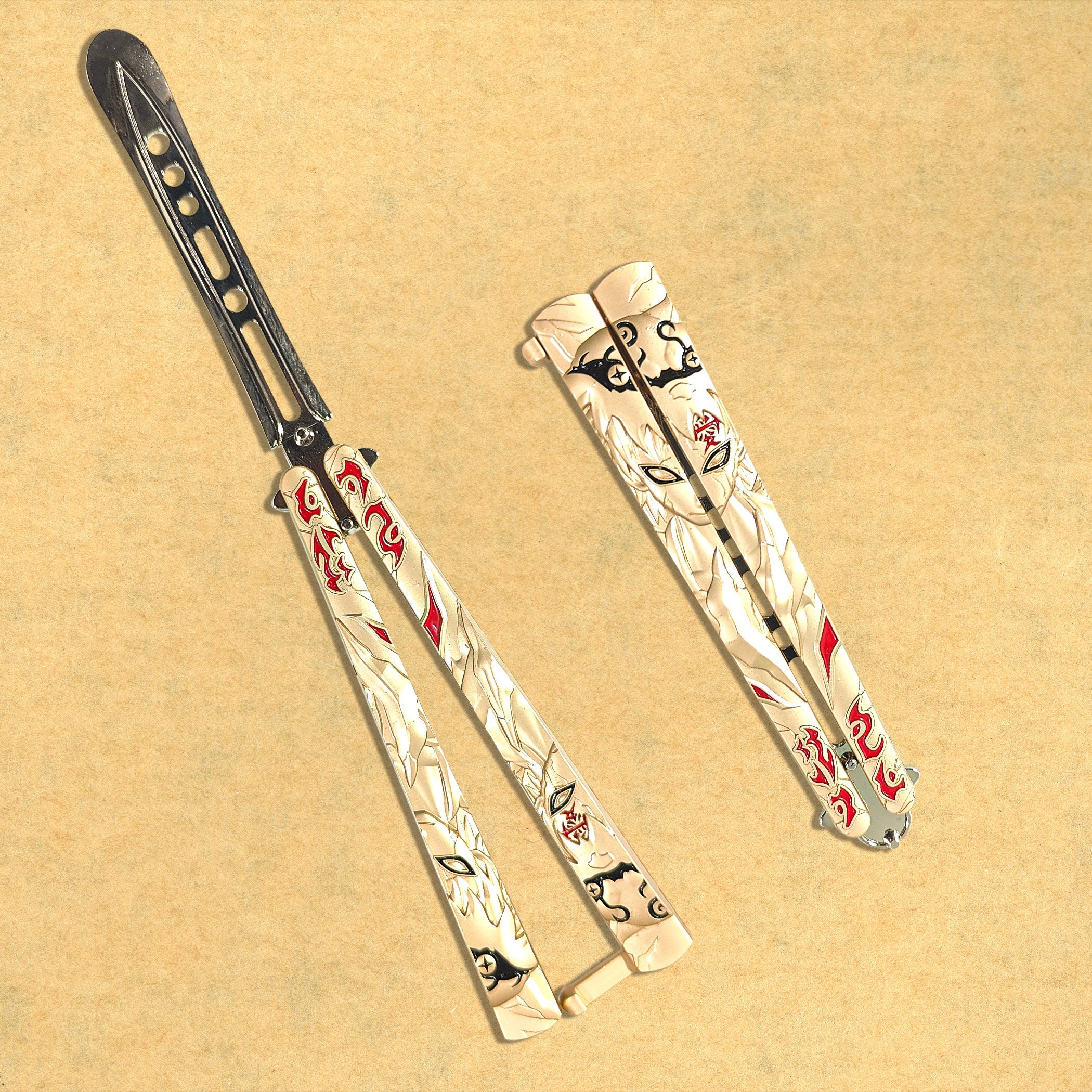 Golden Naruto engraved metal butterfly knife trainer with red accents — decorative balisong blade
